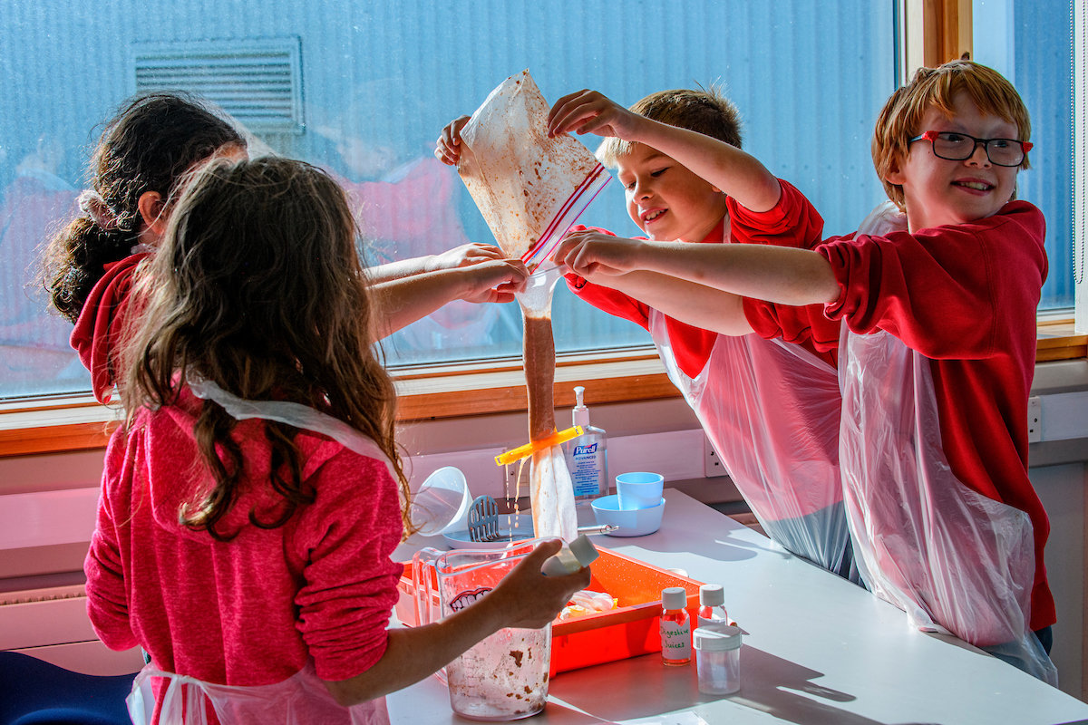Primary pupils experimenting with the science skills academy